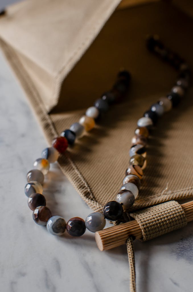 From above of creative design of colorful beads inon marble surface